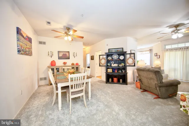 a view of a livingroom with furniture and a chandelier