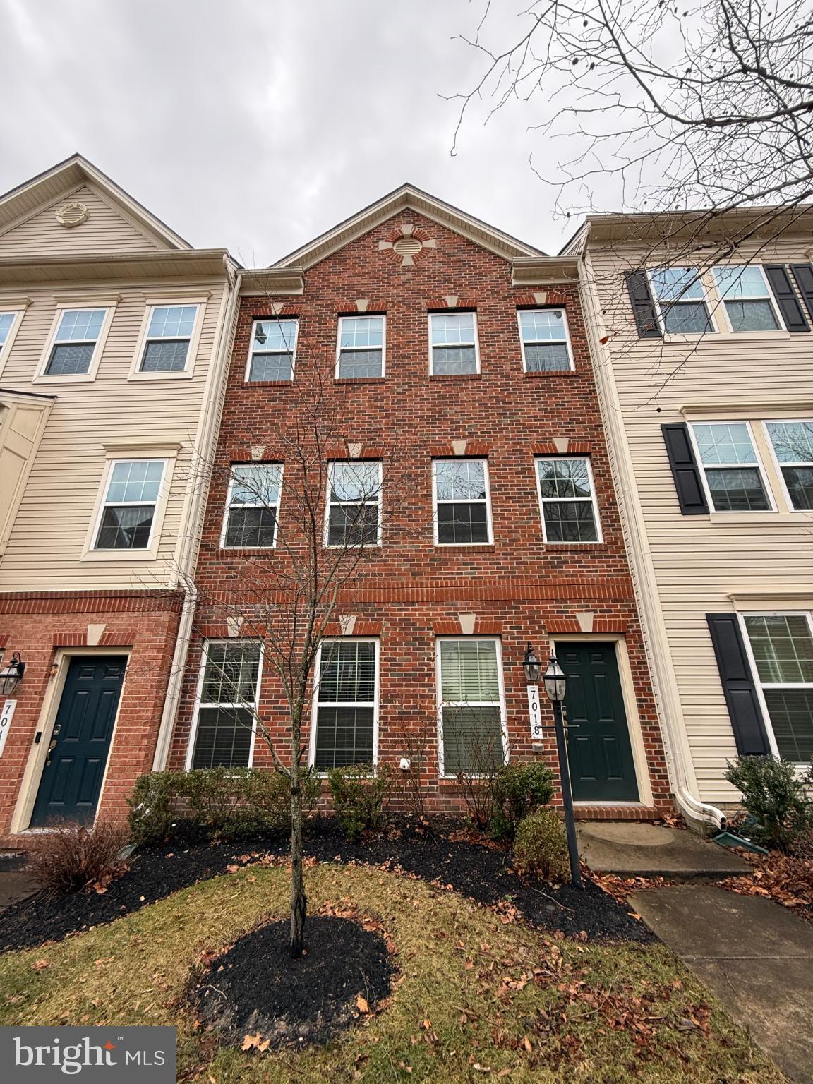 7018 Foxton Way Hanover, MD 21076 - Photo 1 of 72 a front view of a house
