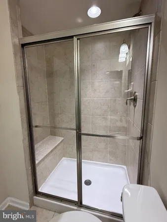 a view of a living room with wooden floor