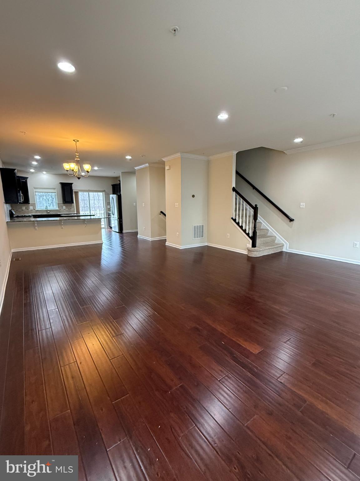 7018 Foxton Way Hanover, MD 21076 - Photo 13 of 72 a view of a room with wooden floor