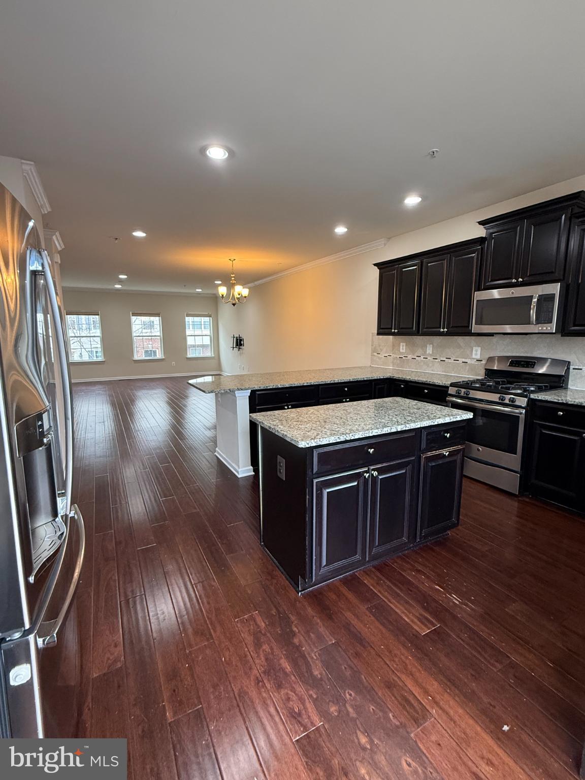 7018 Foxton Way Hanover, MD 21076 - Photo 16 of 72 a kitchen with stainless steel appliances granite countertop a stove a sink and a microwave