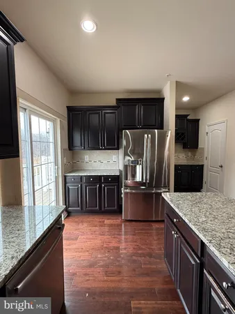 a white toilet sitting next to a sink
