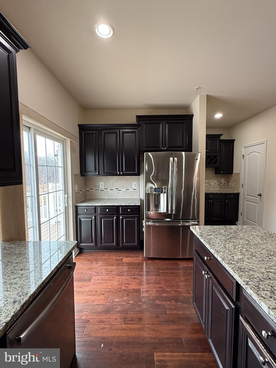 7018 Foxton Way Hanover, MD 21076 - Photo 20 of 72 a kitchen with stainless steel appliances granite countertop a refrigerator a stove a sink and a oven