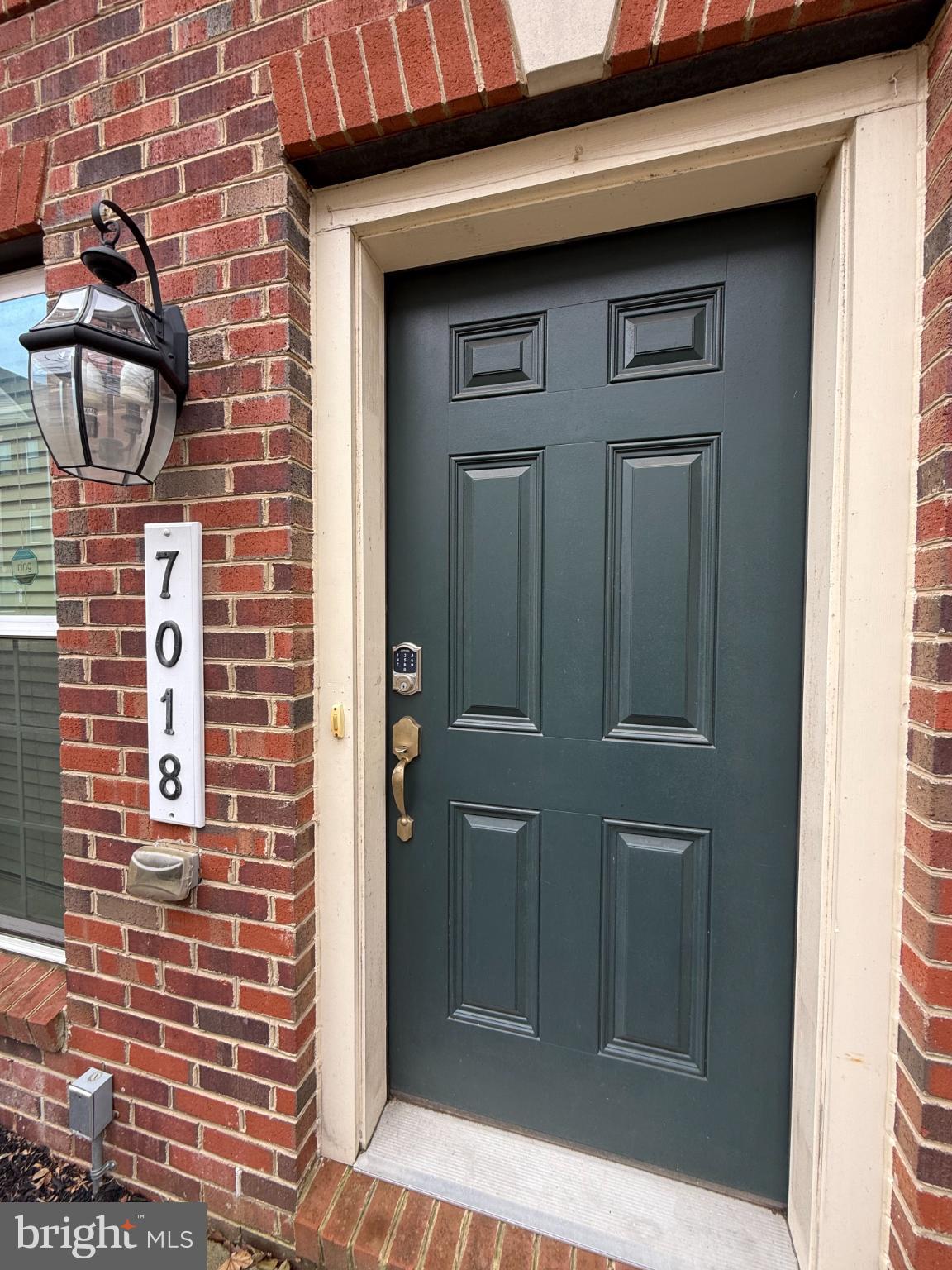 7018 Foxton Way Hanover, MD 21076 - Photo 2 of 72 Charming entrance with classic brick facade.