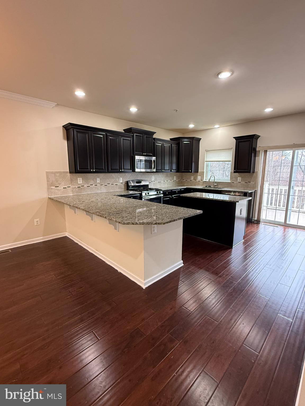 7018 Foxton Way Hanover, MD 21076 - Photo 22 of 72 Modern kitchen with sleek finishes.