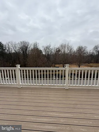 a view of kitchen with furniture and wooden floor