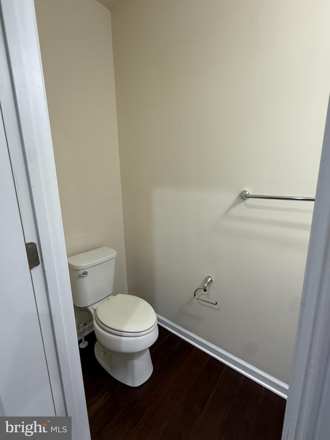 7018 Foxton Way Hanover, MD 21076 - Photo 27 of 72 a white toilet sitting next to a sink