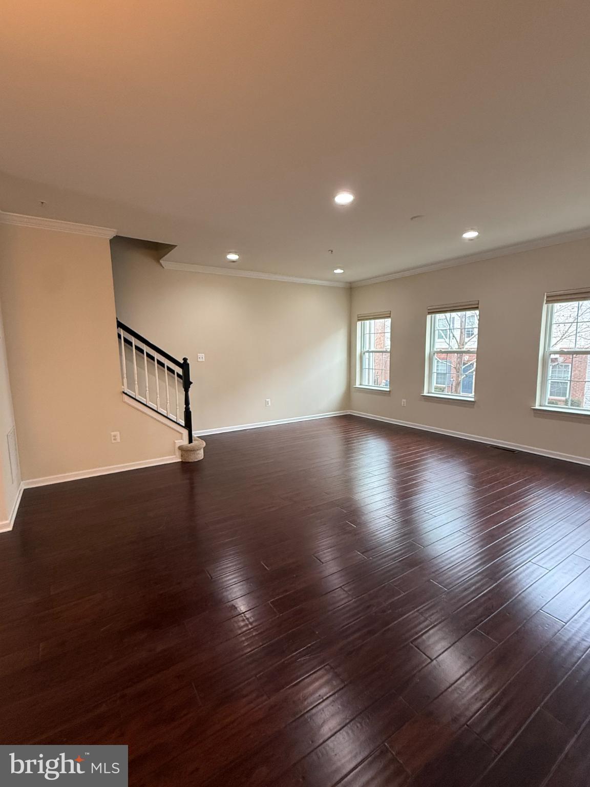 7018 Foxton Way Hanover, MD 21076 - Photo 31 of 72 a view of an empty room with wooden floor and a window