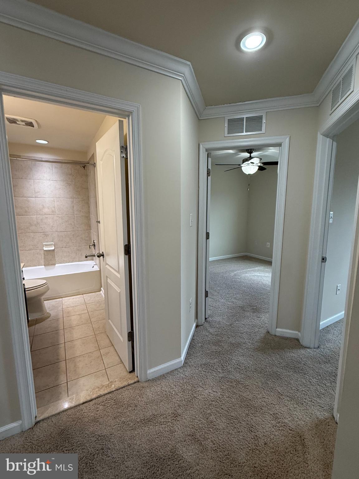 7018 Foxton Way Hanover, MD 21076 - Photo 33 of 72 Spacious hallway leading to serene rooms.