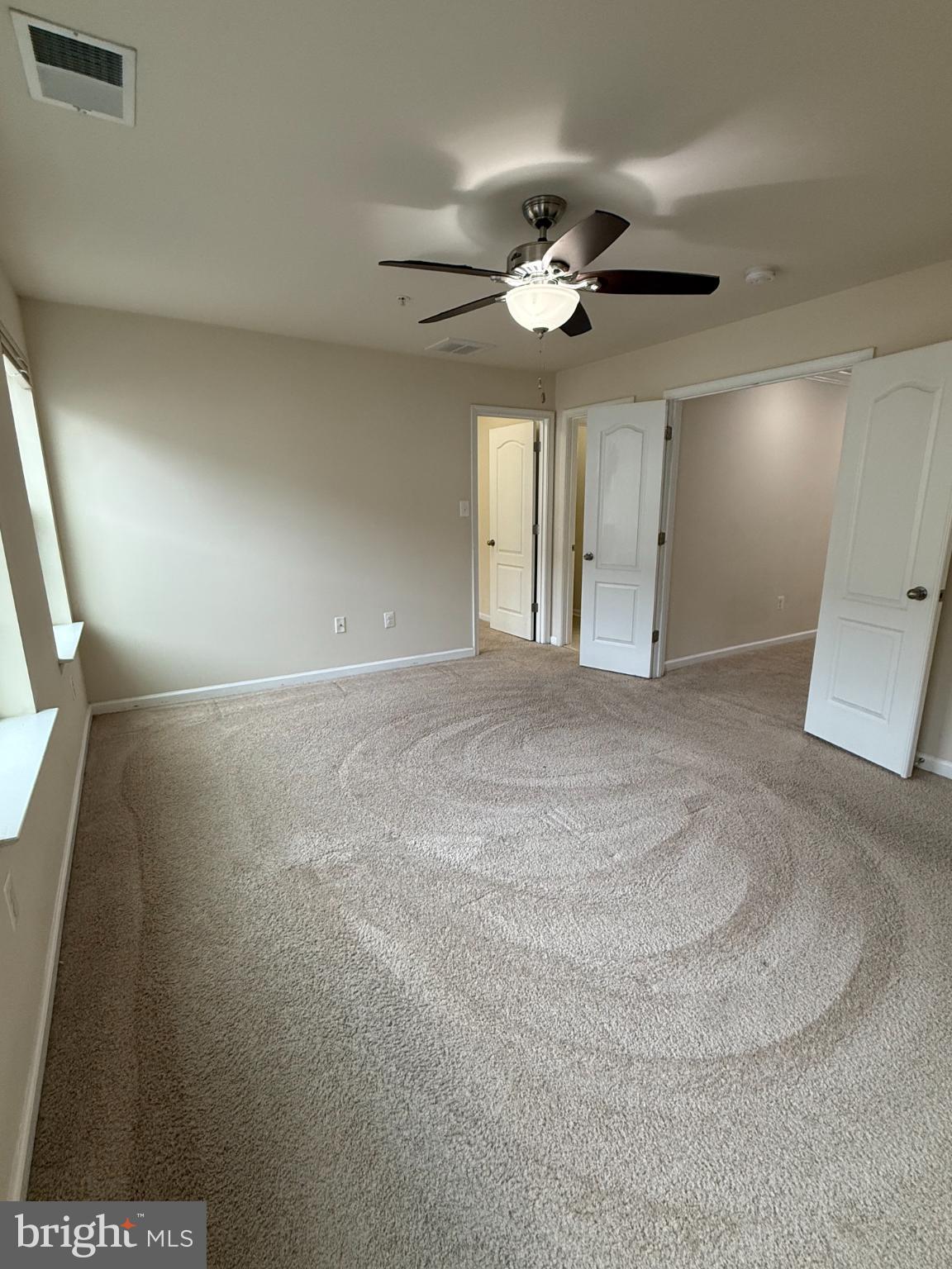 7018 Foxton Way Hanover, MD 21076 - Photo 35 of 72 a view of an empty room with a ceiling fan
