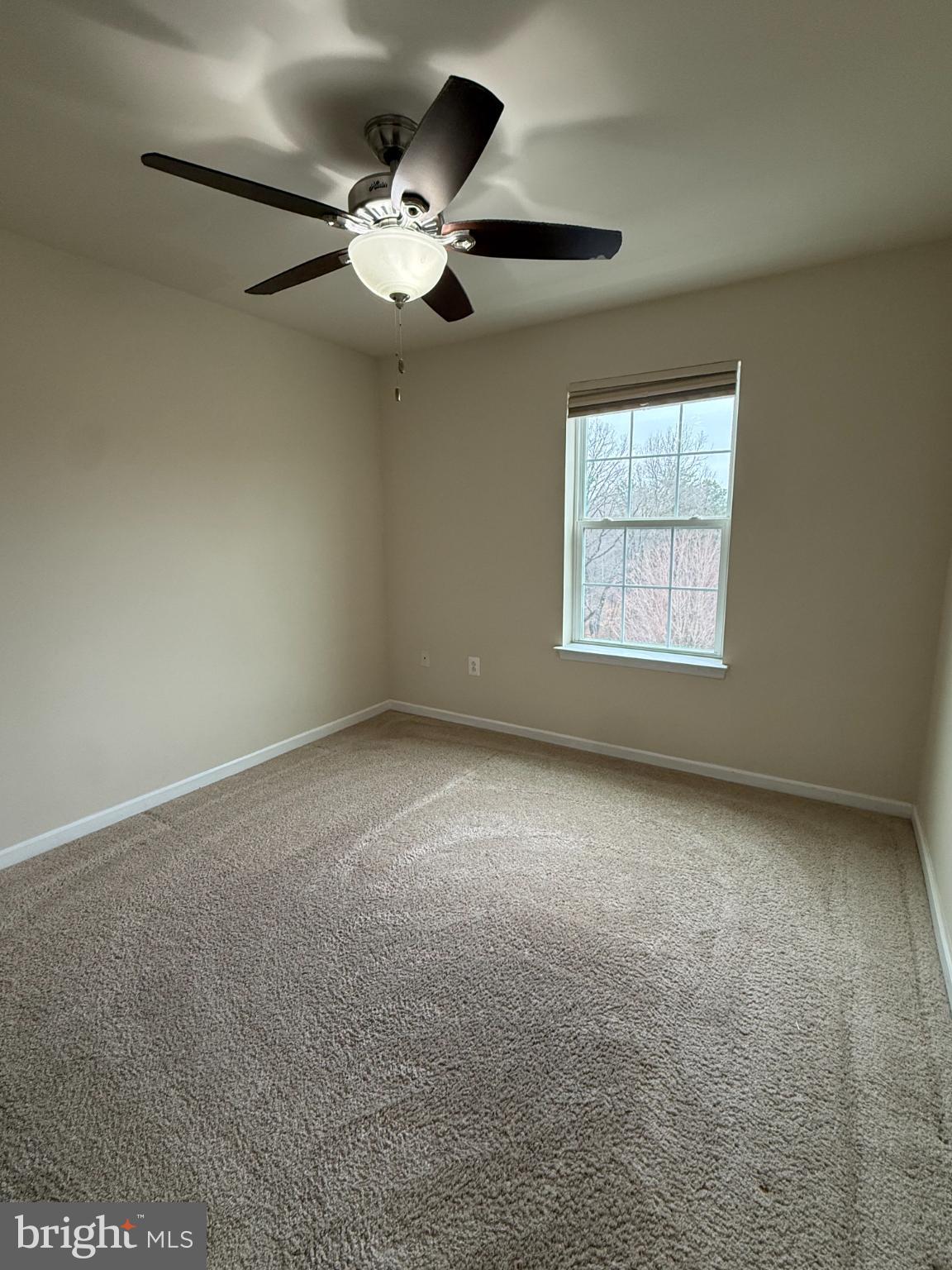 7018 Foxton Way Hanover, MD 21076 - Photo 42 of 72 an empty room with windows and fan