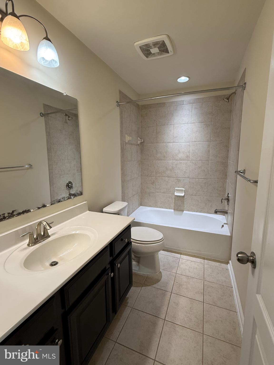 7018 Foxton Way Hanover, MD 21076 - Photo 44 of 72 a bathroom with a sink a toilet and a bathtub