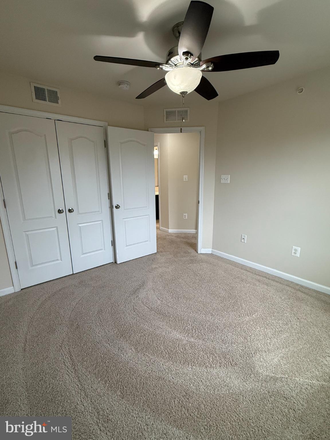 7018 Foxton Way Hanover, MD 21076 - Photo 46 of 72 a view of an empty room with a chandelier fan