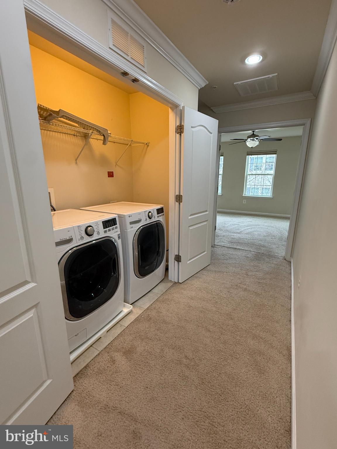 7018 Foxton Way Hanover, MD 21076 - Photo 47 of 72 a view of a storage & utility room with washer and dryer
