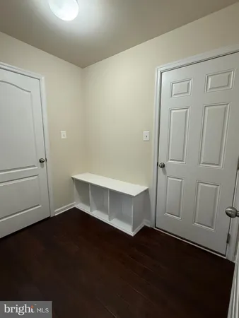 a view of entryway with wooden floor