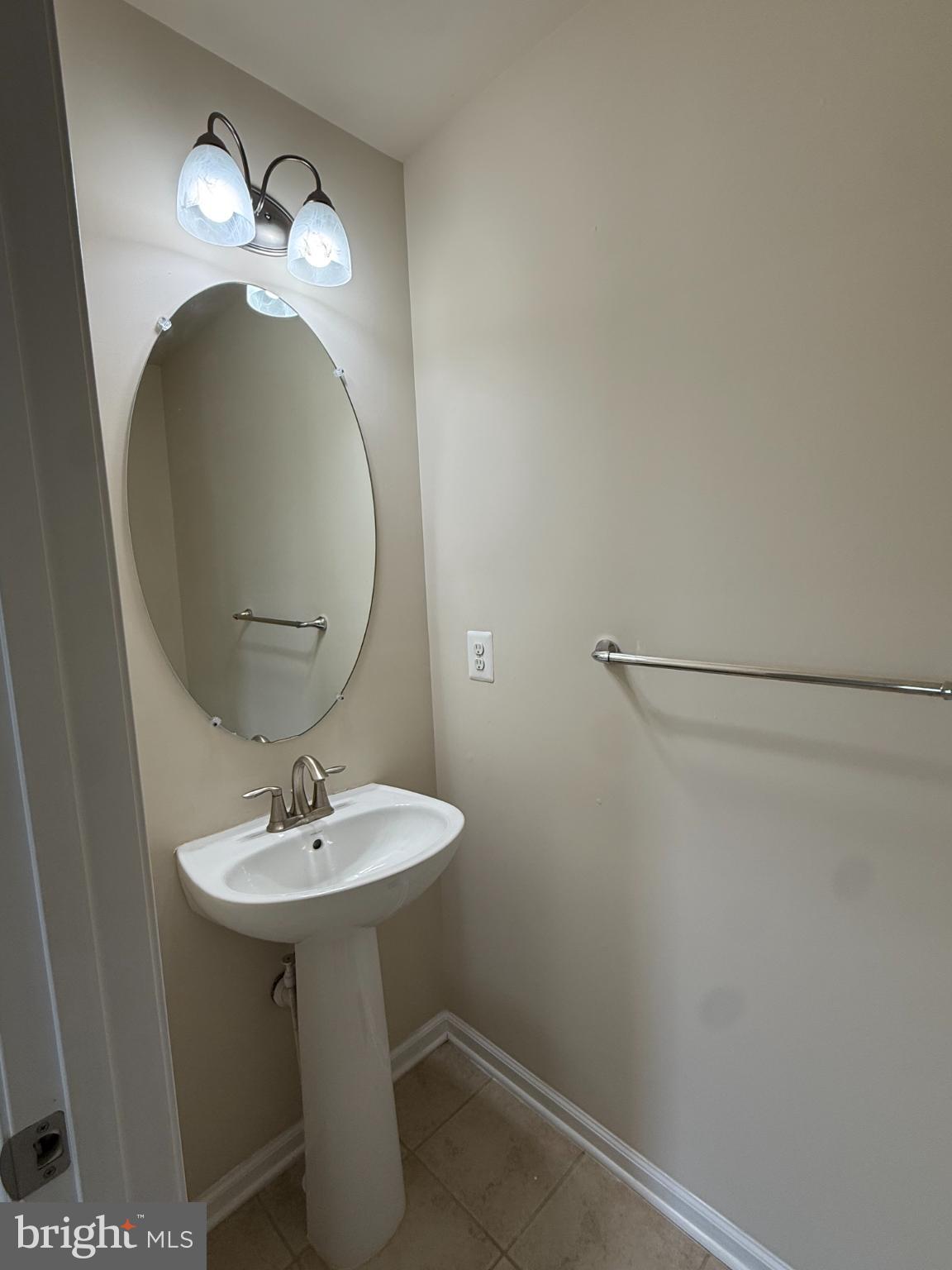 7018 Foxton Way Hanover, MD 21076 - Photo 51 of 72 a bathroom with a sink and a mirror