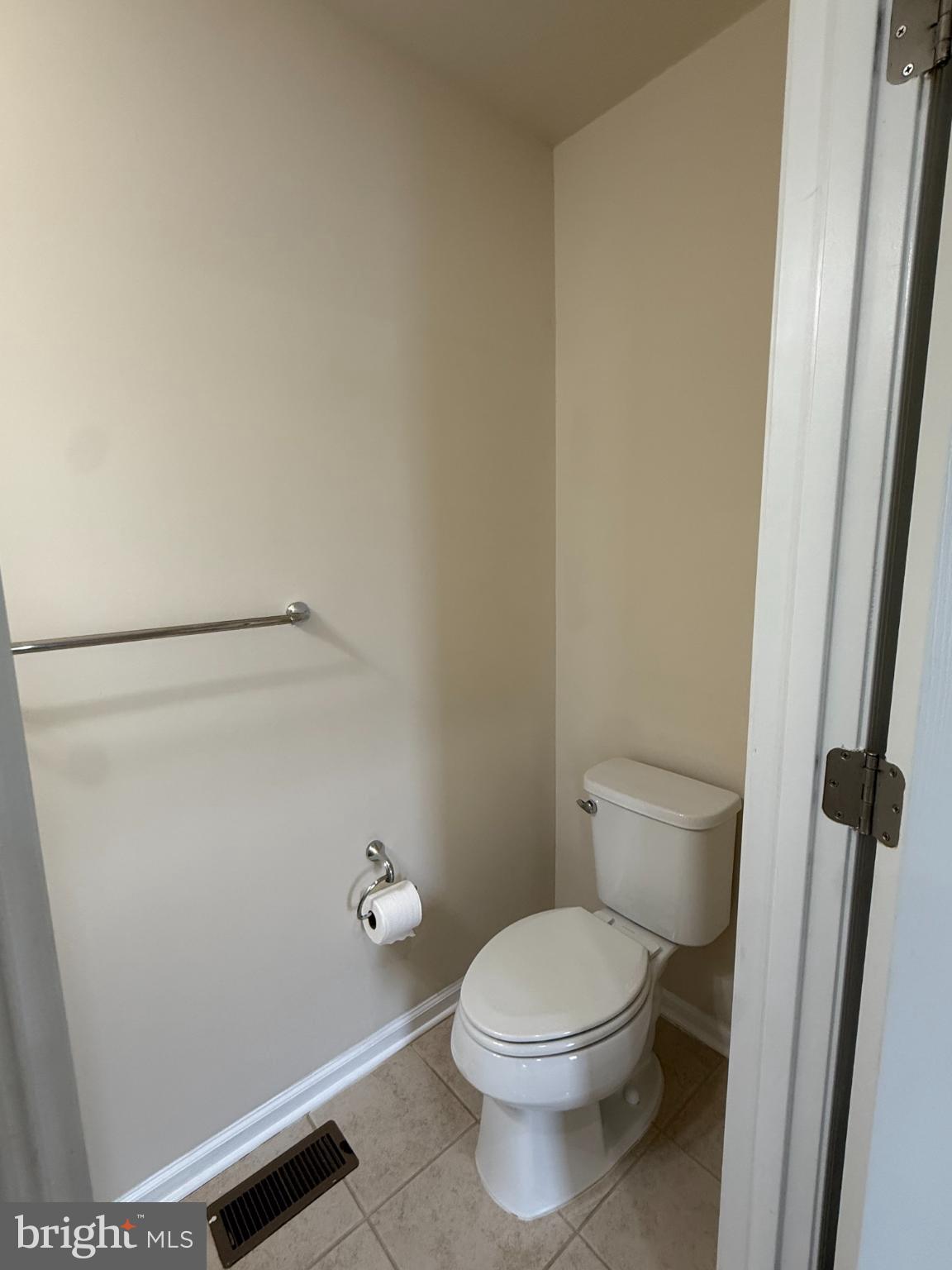 7018 Foxton Way Hanover, MD 21076 - Photo 52 of 72 a white toilet sitting next to a shower