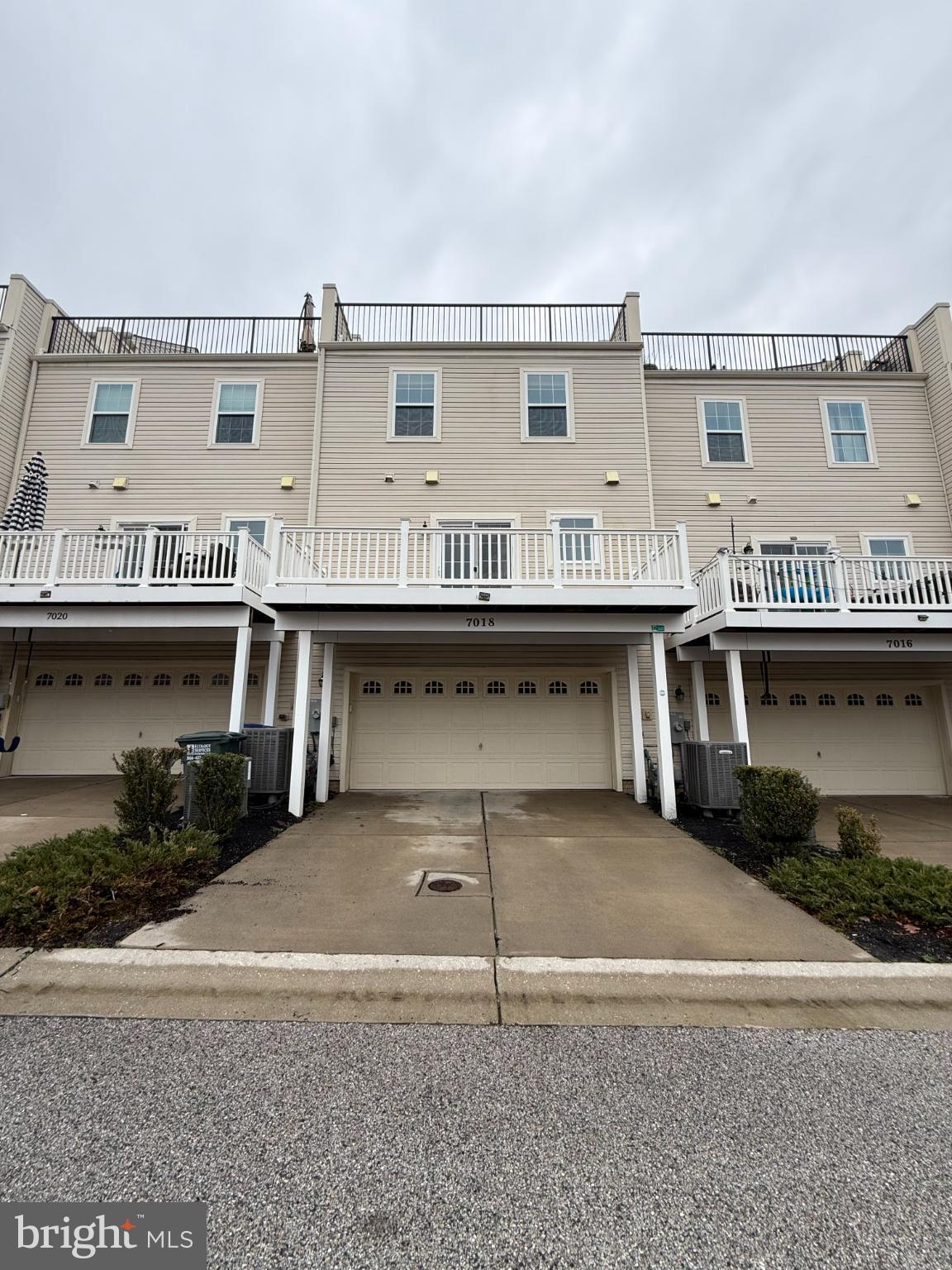 7018 Foxton Way Hanover, MD 21076 - Photo 57 of 72 a front view of a house with yard