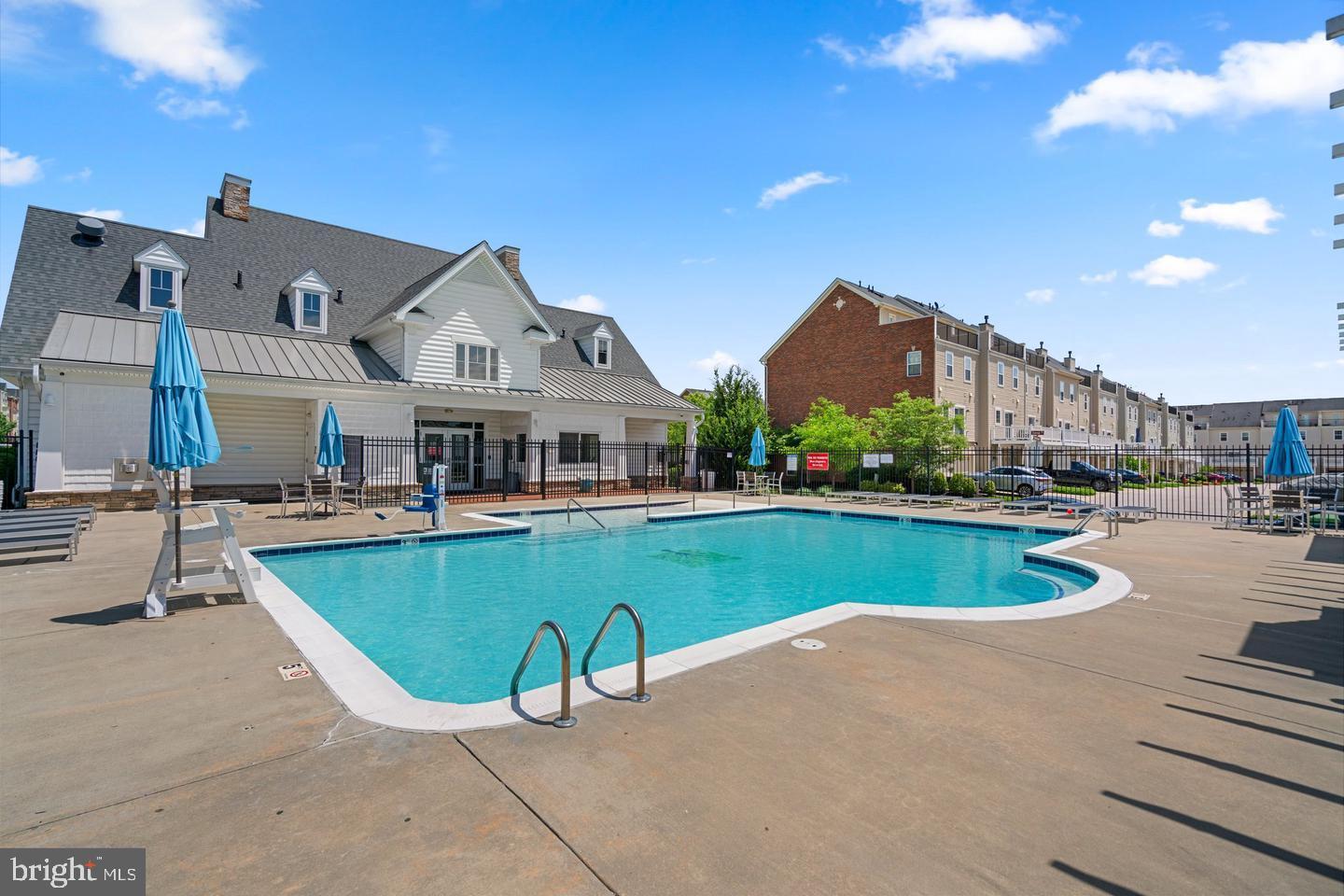 7018 Foxton Way Hanover, MD 21076 - Photo 62 of 72 a view of a house with a swimming pool