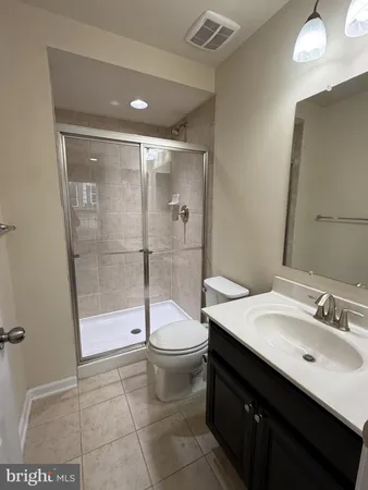 a bathroom with a shower and toilet