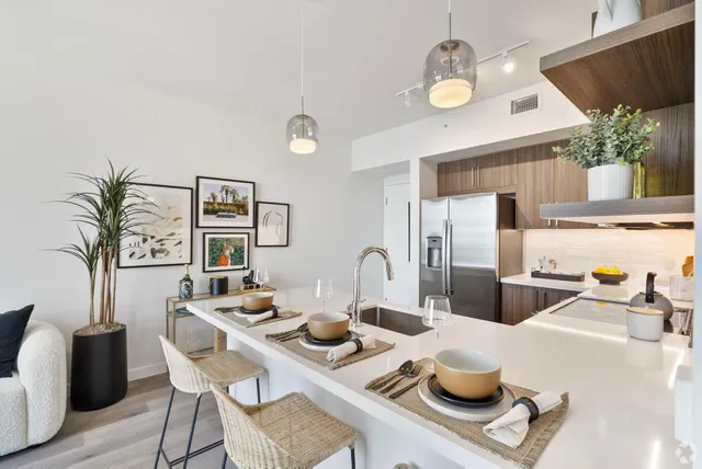 a kitchen with a table and chairs in it