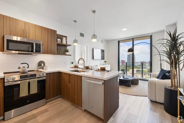 a kitchen with stainless steel appliances granite countertop a stove and a sink
