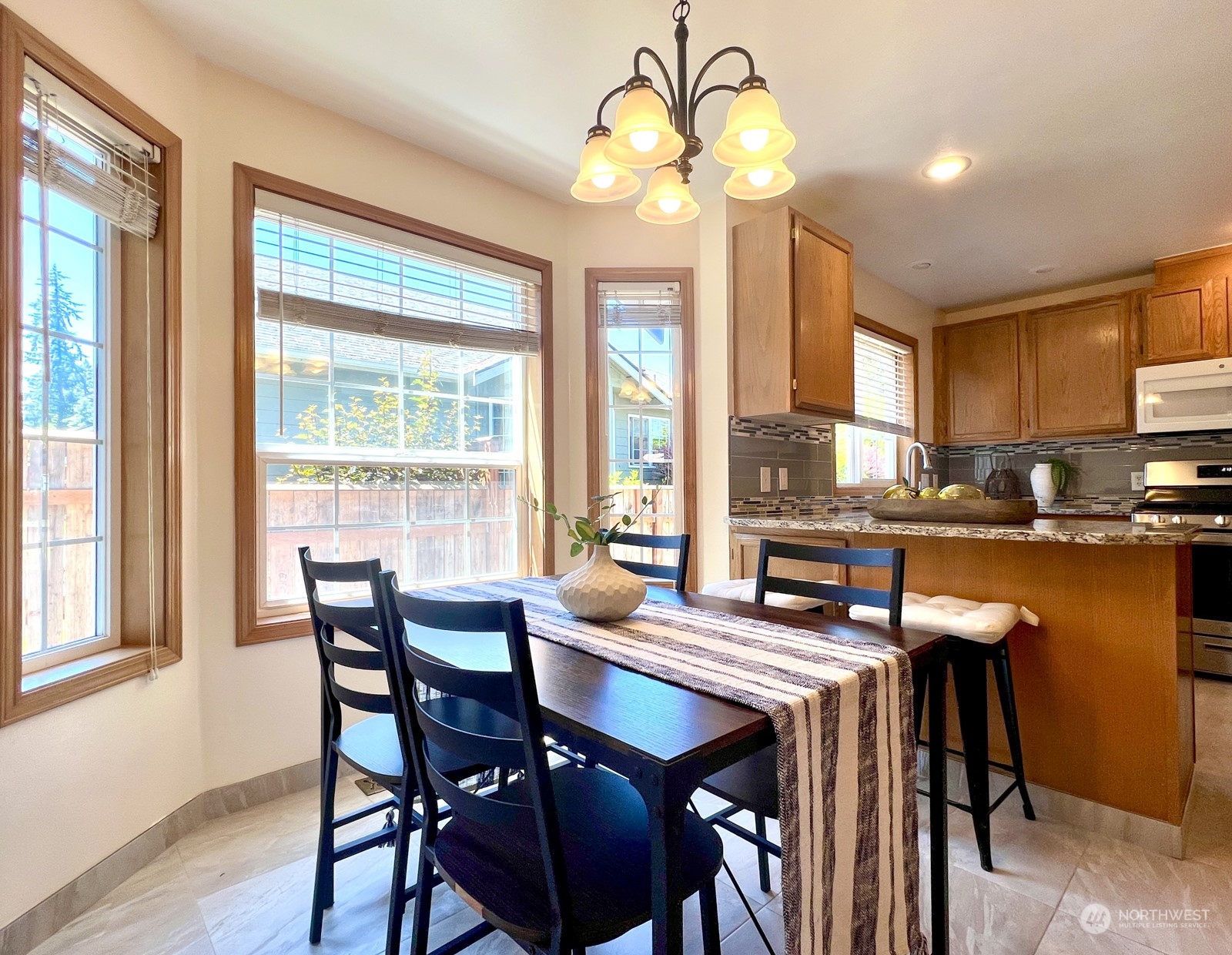 4019 Northeast 17th Street Renton, WA 98056 - Photo 11 of 37 a view of a dining room with furniture window and wooden floor
