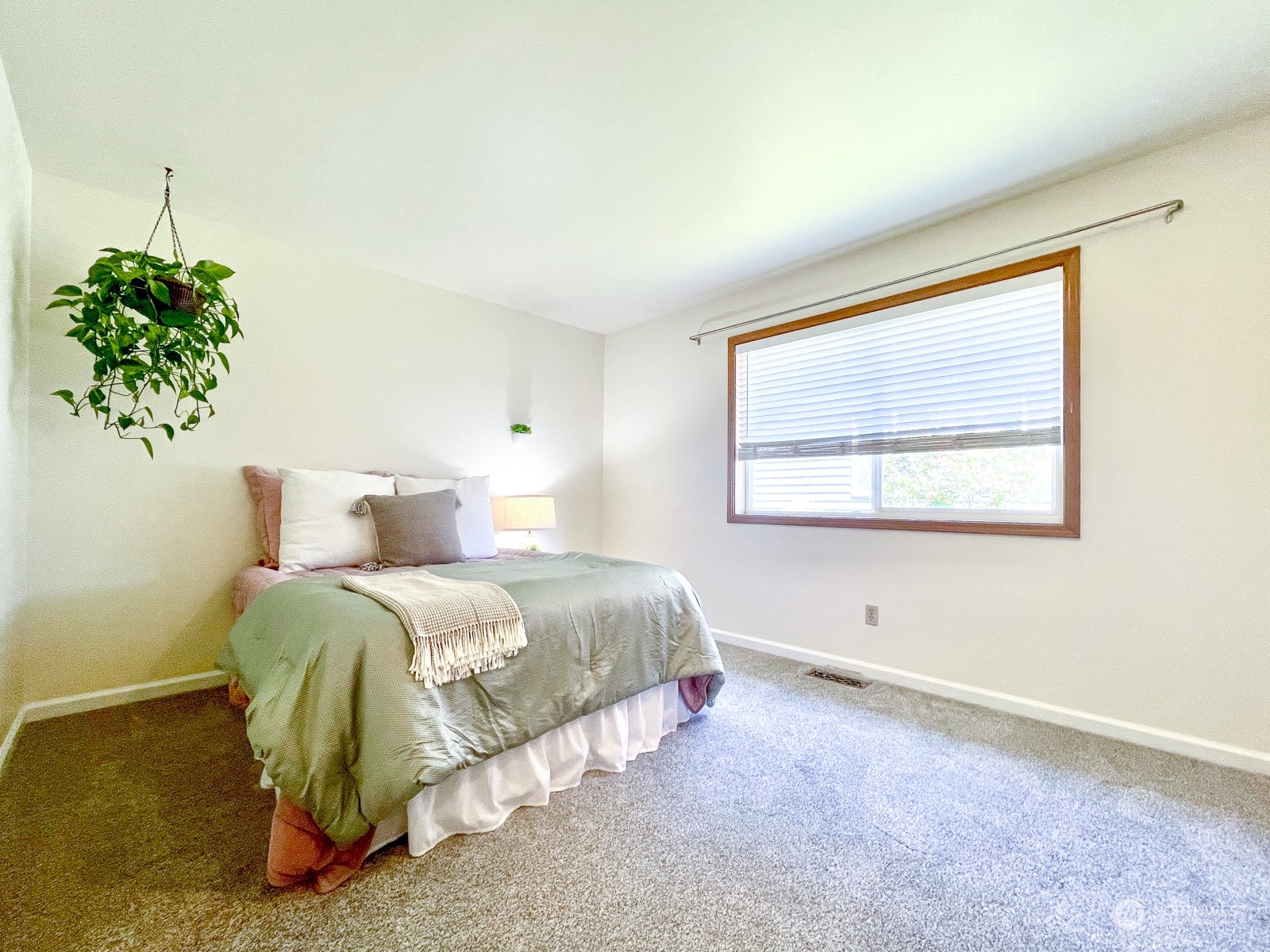 4019 Northeast 17th Street Renton, WA 98056 - Photo 15 of 37 a spacious bedroom with a bed and a window