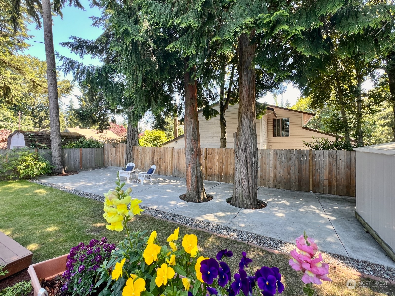 4019 Northeast 17th Street Renton, WA 98056 - Photo 28 of 37 a view of swimming pool with sitting area and garden