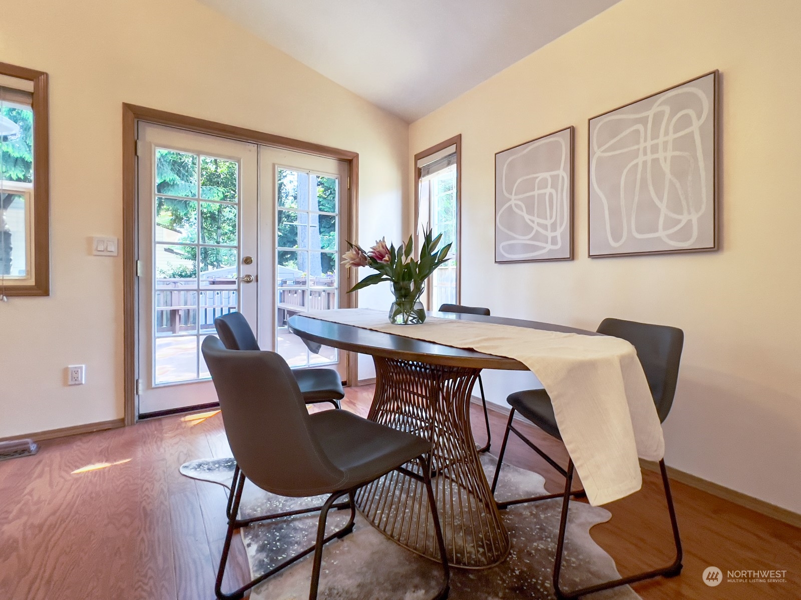 4019 Northeast 17th Street Renton, WA 98056 - Photo 9 of 37 a view of a dining room with furniture window and wooden floor
