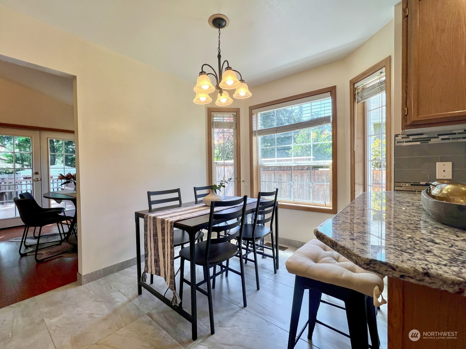 4019 Northeast 17th Street Renton, WA 98056 - Photo 10 of 37 a view of a dining room with furniture window and outside view