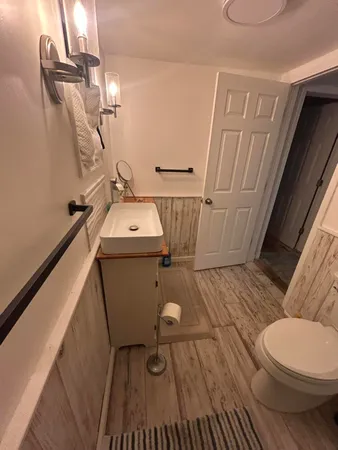 a bathroom with a sink and toilet