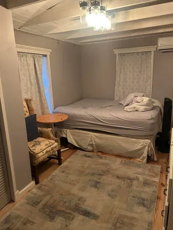 a room with a bed and a window