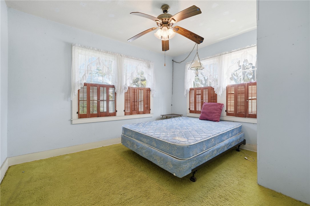 301 Laurel Street Fulton, TX 78382 - Photo 11 of 20 a bedroom with a bed and window