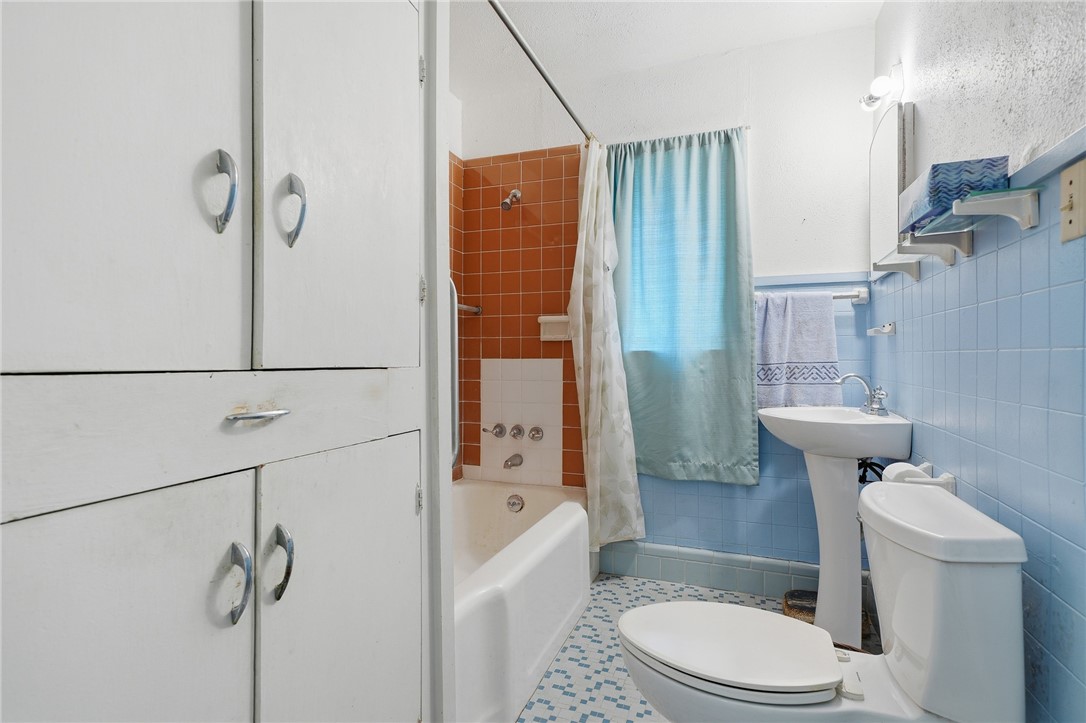 301 Laurel Street Fulton, TX 78382 - Photo 12 of 20 a bathroom with a toilet and shower