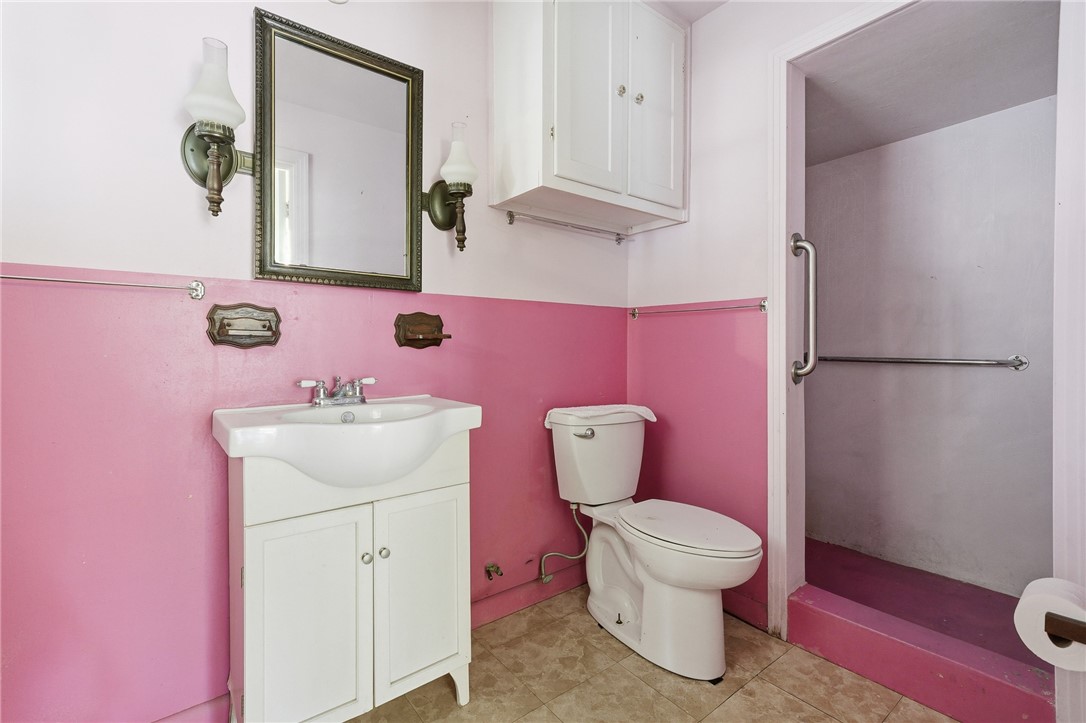 301 Laurel Street Fulton, TX 78382 - Photo 17 of 20 a bathroom with a sink toilet and mirror