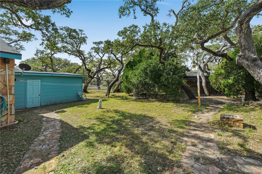 301 Laurel Street Fulton, TX 78382 - Photo 18 of 20 a backyard of a house with lots of green space