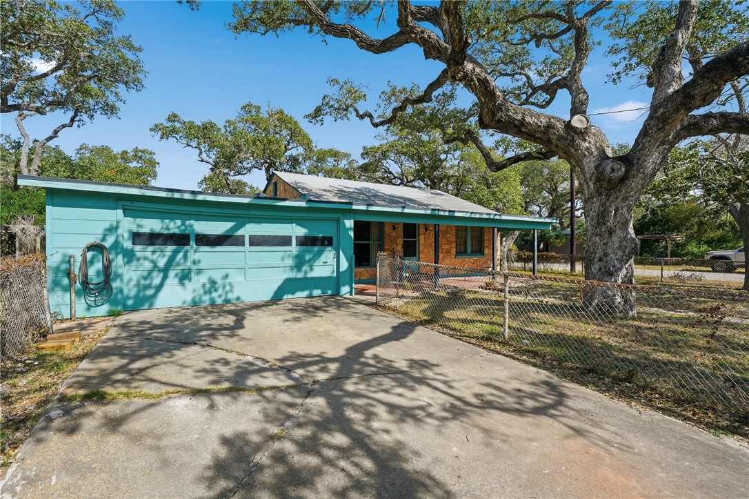 301 Laurel Street Fulton, TX 78382 - Photo 2 of 20 a view of a house with a tree in the background