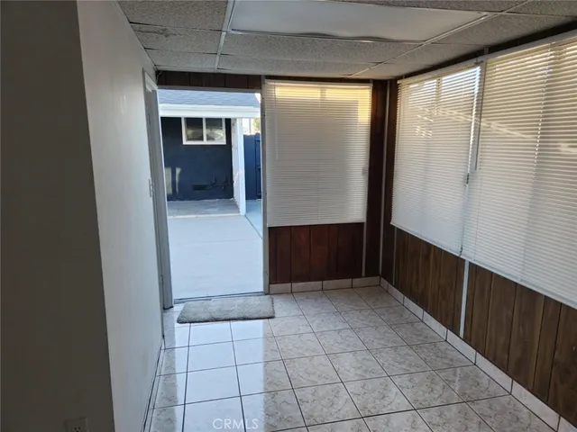 a bedroom with furniture and a wooden floor