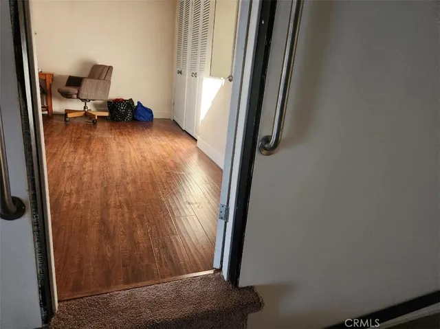 a white toilet sitting next to a shower