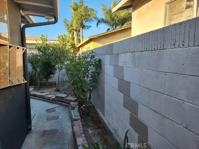a view of a livingroom and an empty room