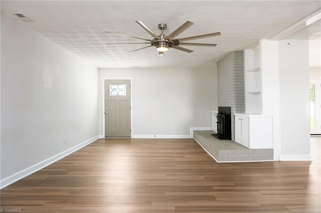 3025 Hickory Tree Road Winston-Salem, NC 27127 - Photo 14 of 33 Looking back at the back single door. Could be Den/Dining combo HUGE ROOM