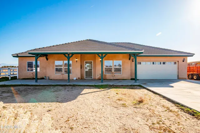a swimming pool with lawn chairs