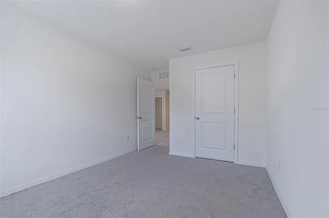 a bathroom with a granite countertop sink toilet and bathtub