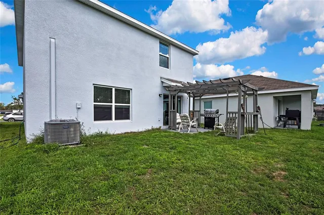 a front view of a house with a garden and porch