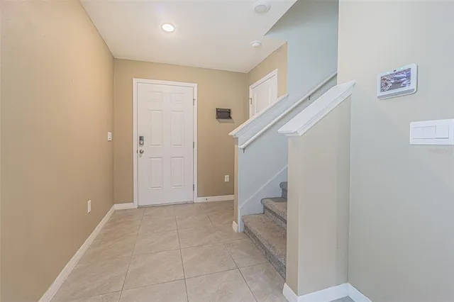 a large kitchen with a large counter top stainless steel appliances and cabinets