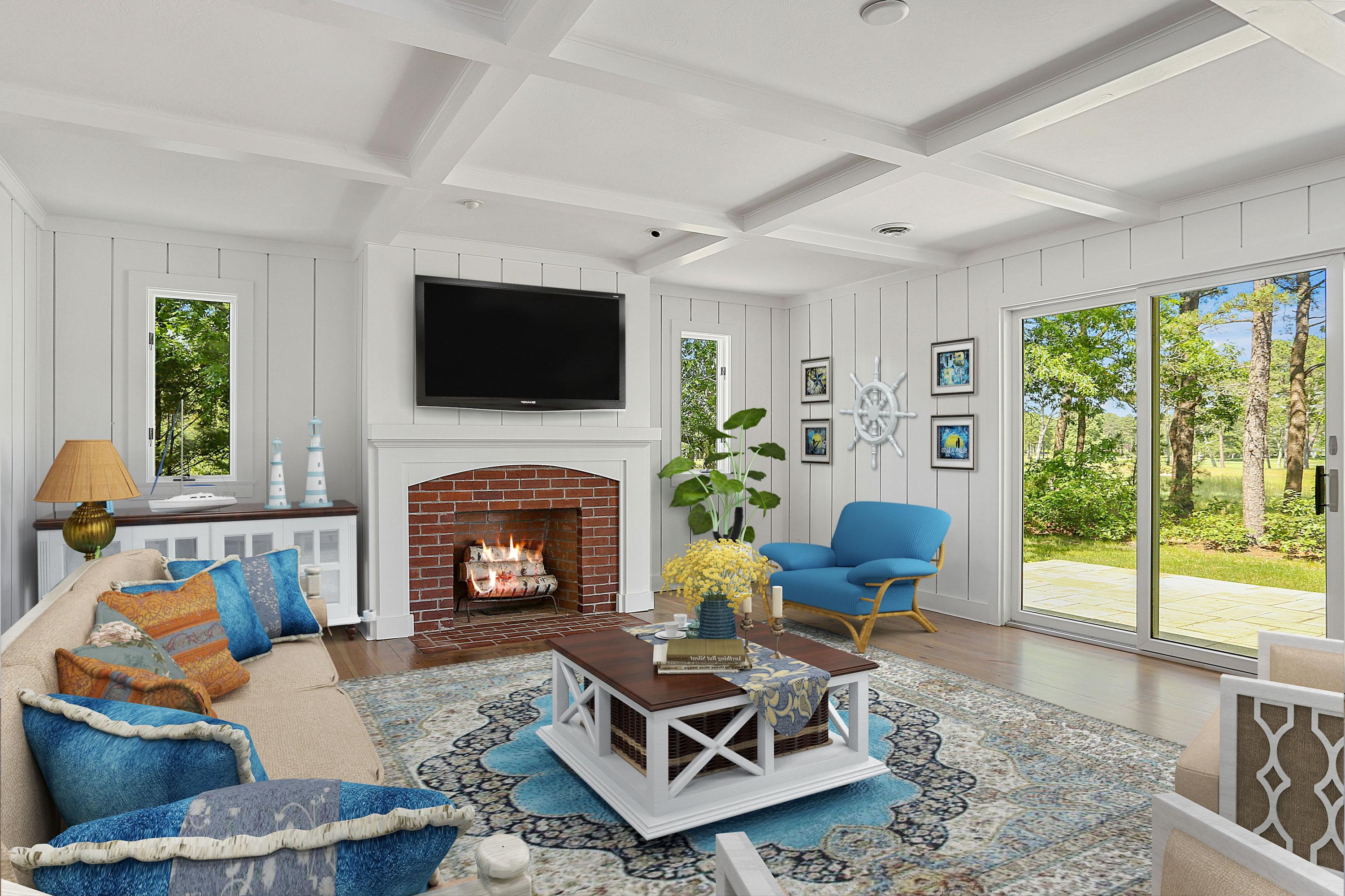 140 Pineleigh Path Osterville, MA 02655 - Photo 11 of 29 a living room with furniture a flat screen tv and a fireplace