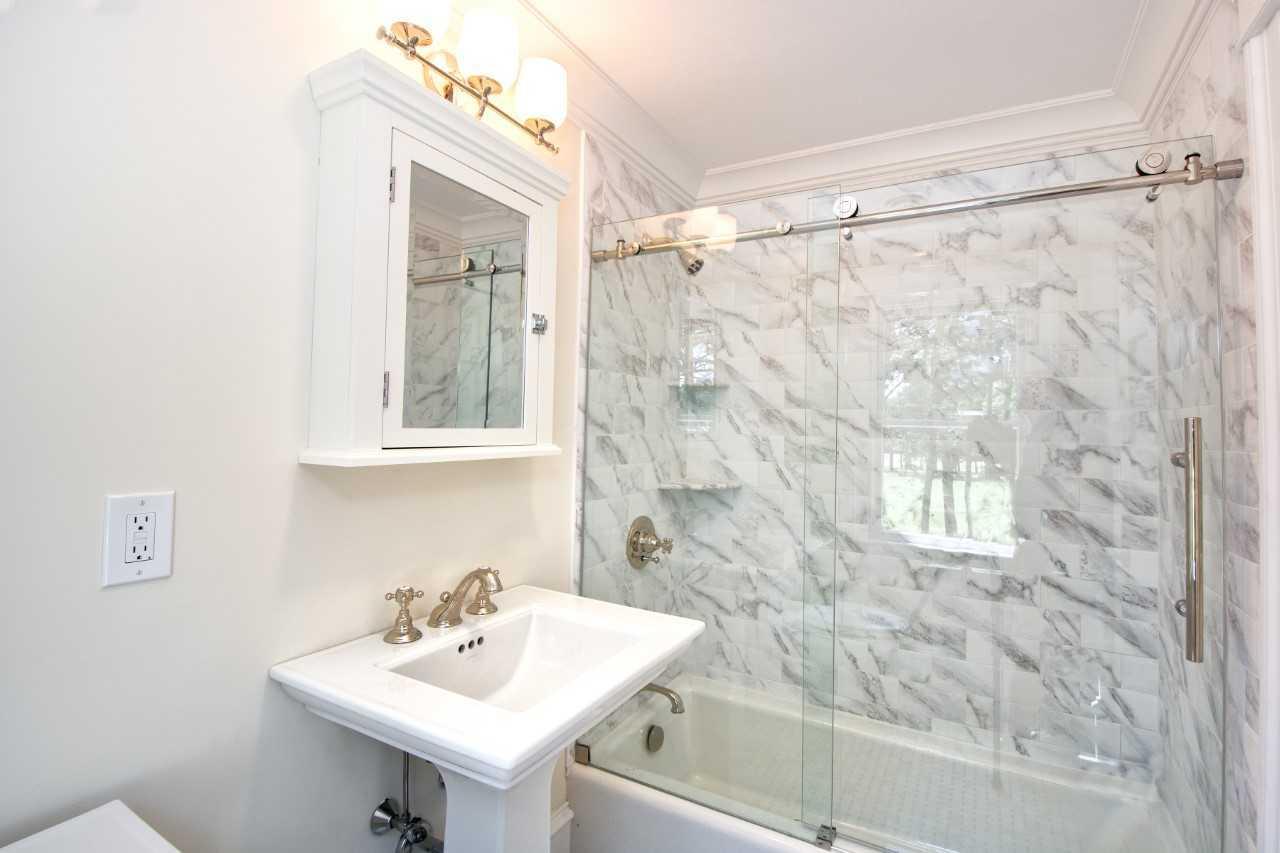 140 Pineleigh Path Osterville, MA 02655 - Photo 22 of 29 a bathroom with a sink a mirror and a shower