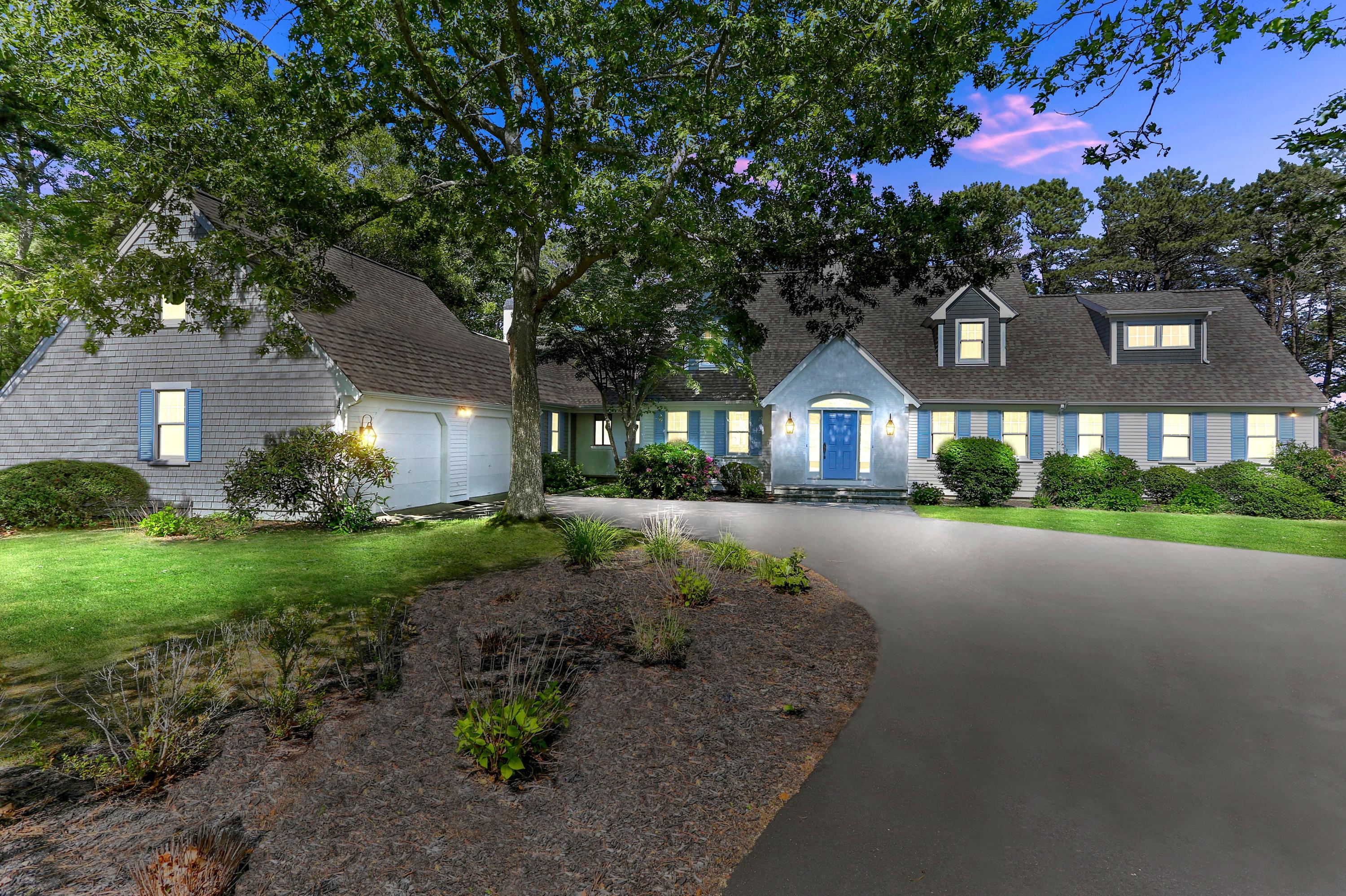 140 Pineleigh Path Osterville, MA 02655 - Photo 28 of 29 a front view of a house with a yard and outdoor seating