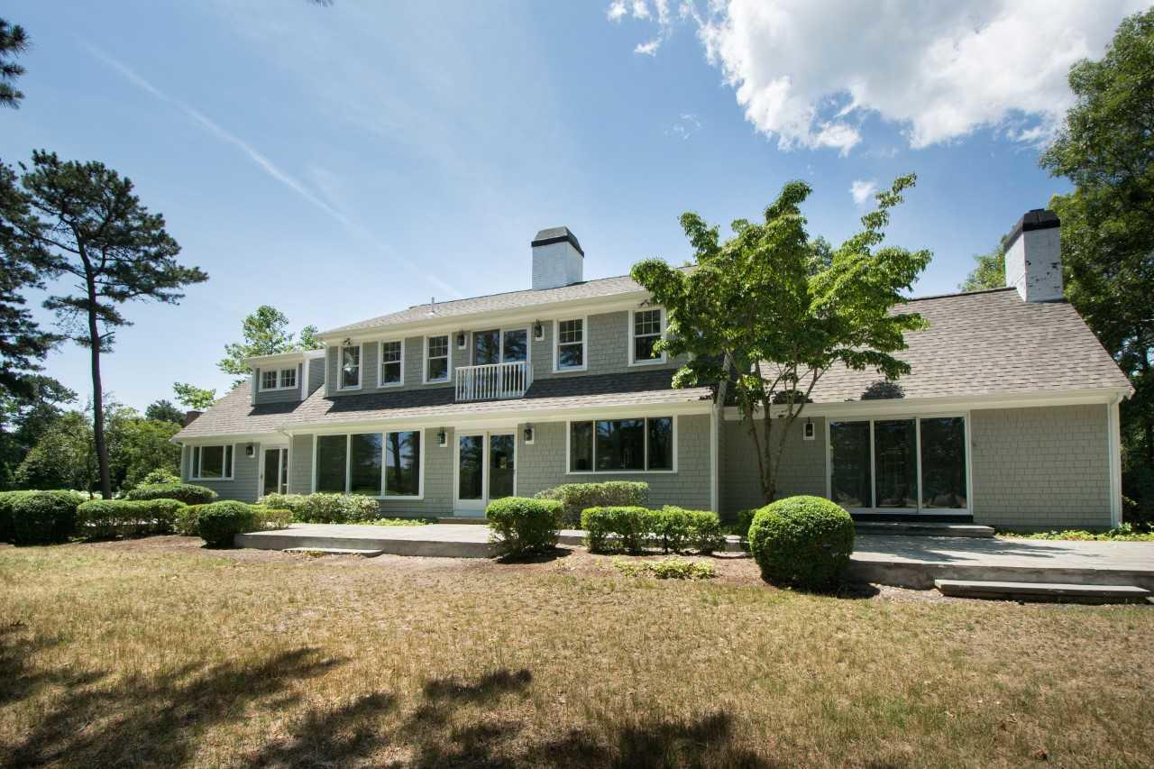 140 Pineleigh Path Osterville, MA 02655 - Photo 29 of 29 a view of a house with a yard and plants